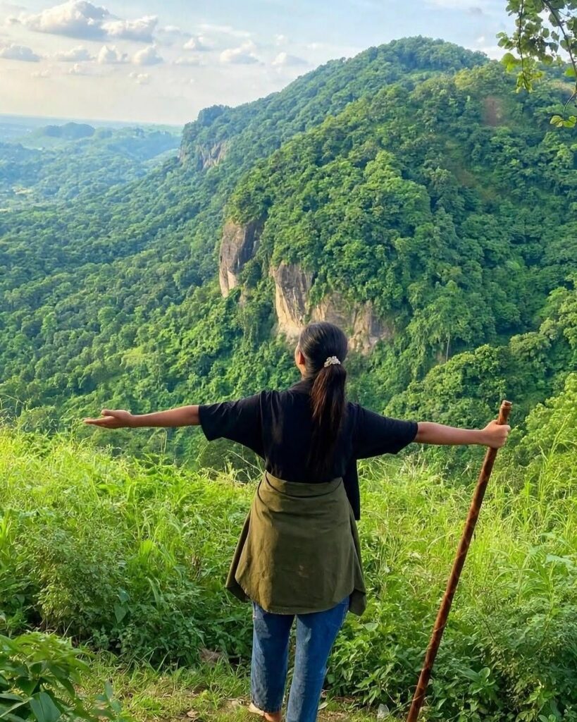 A traveller on a green hilltop in Sitakunda